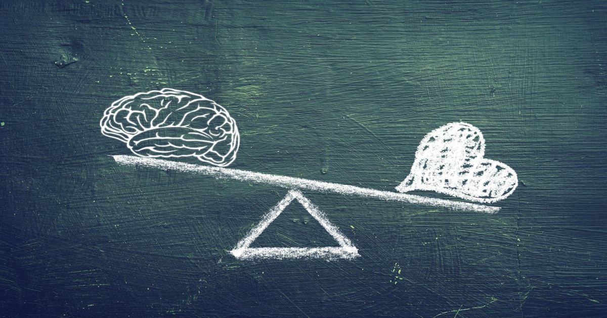 Illustration of a brain and heart balancing on a scale.