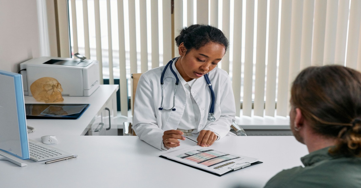 A doctor explaining the patient's results to the patient.