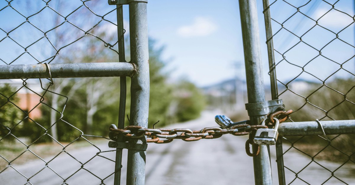 A gate that's closed with a lock.