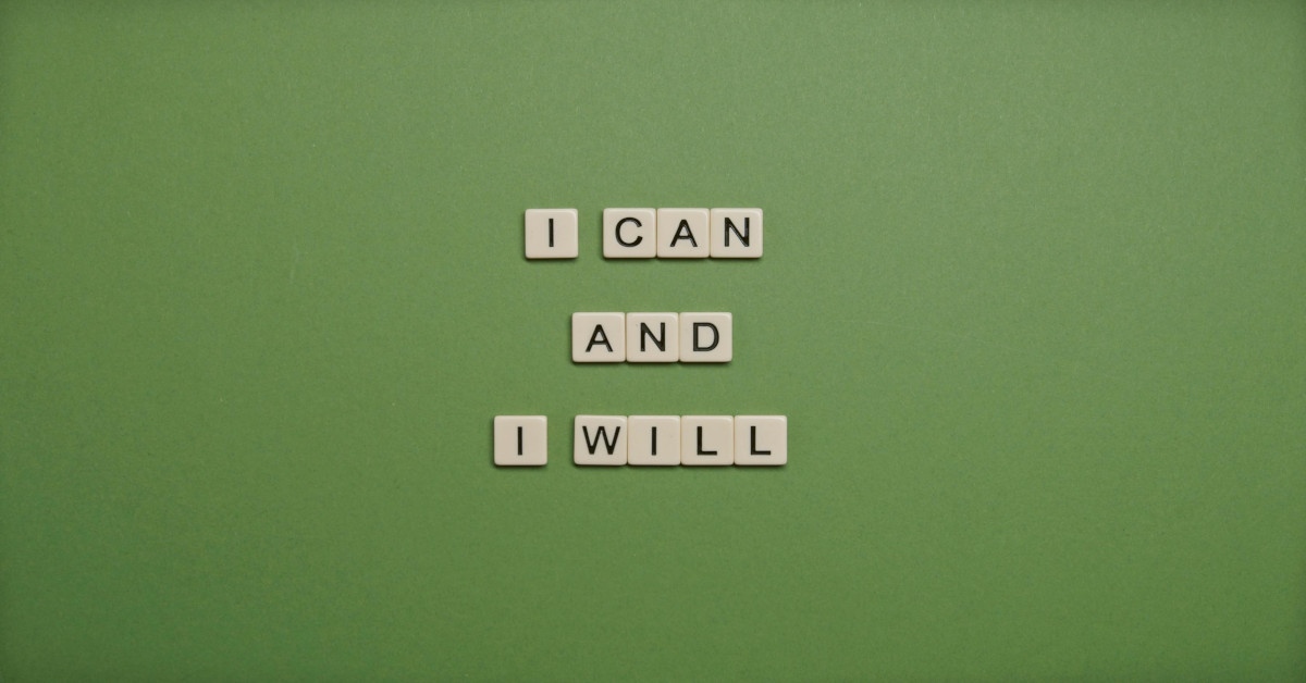 The sentence, "I can and I will" made with scrabble blocks on a green background.