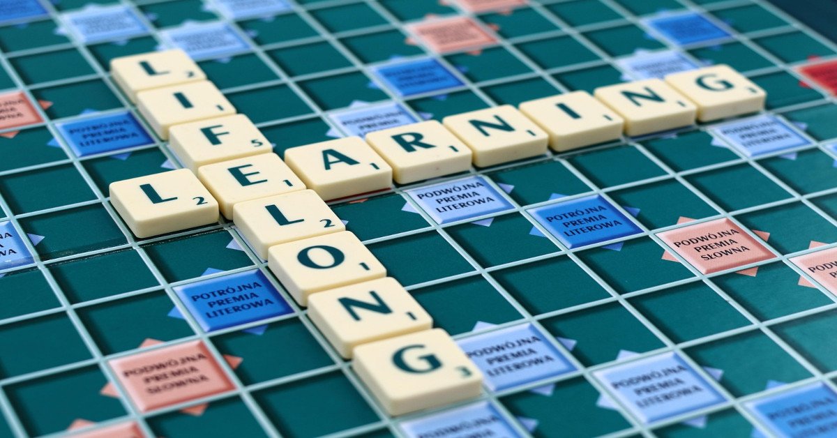 "Lifelong learning" made with Scrabble blocks on a board.