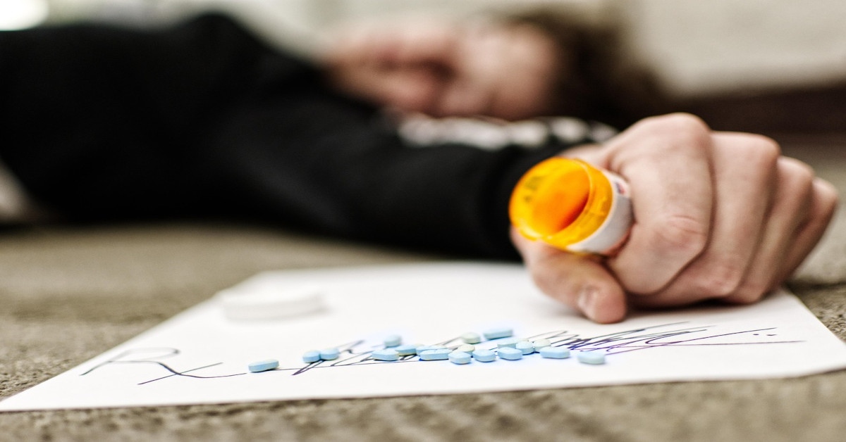 A person suffering from an overdose of pills.