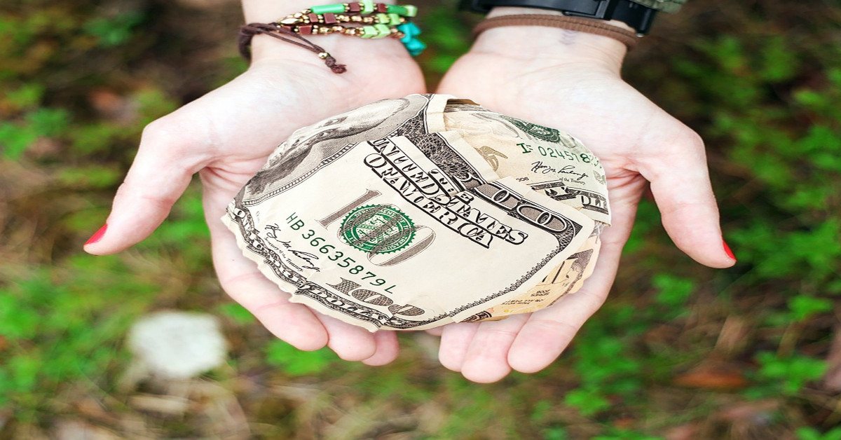A person offering money to someone else.