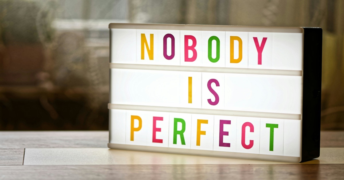 A sign reading "nobody is perfect".