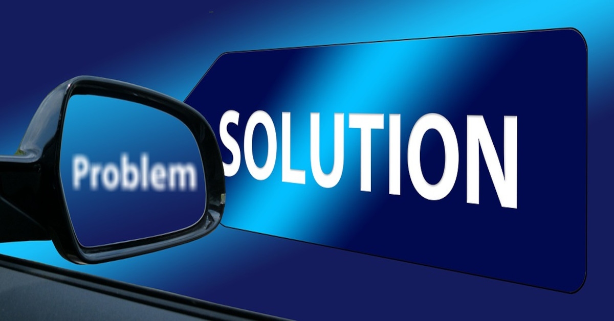 Illustration of the word "problem" written in a car's rearview and the word "solution" written outside next to it, indicating we should think in solutions instead of problems.