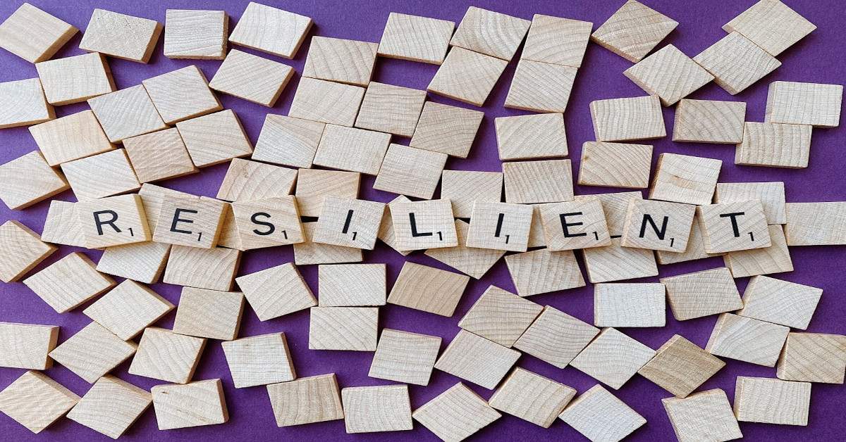 The word "resilient" is made with Scrabble blocks.