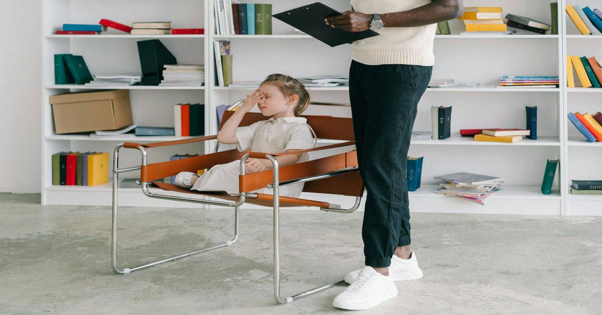 A school psychologist counseling a distressed child.
