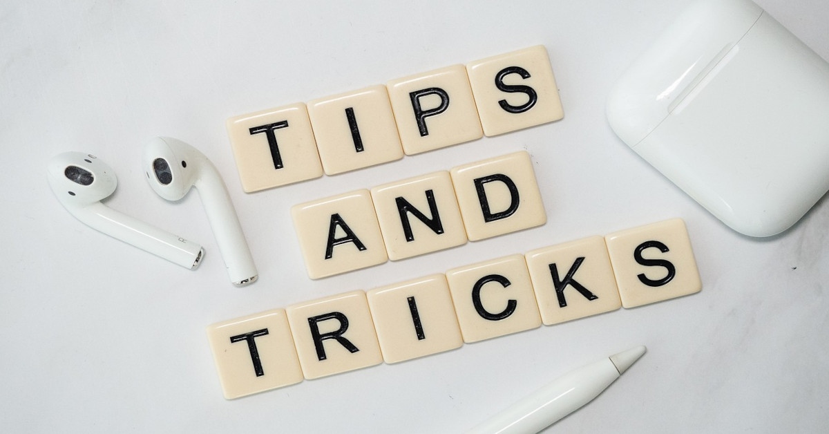 The sentence, "tips and tricks" made with scrabble blocks.