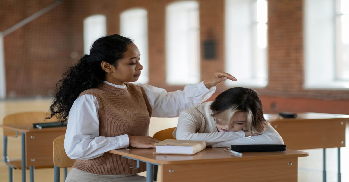 A university counselor comforting a student.