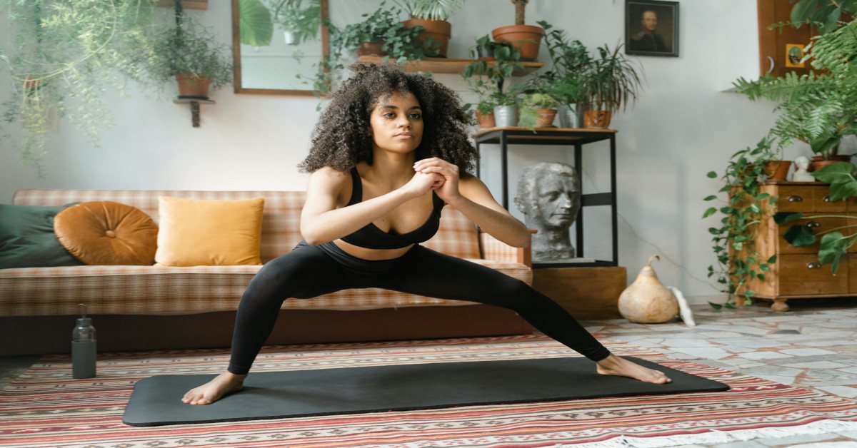 A woman exercising at home.