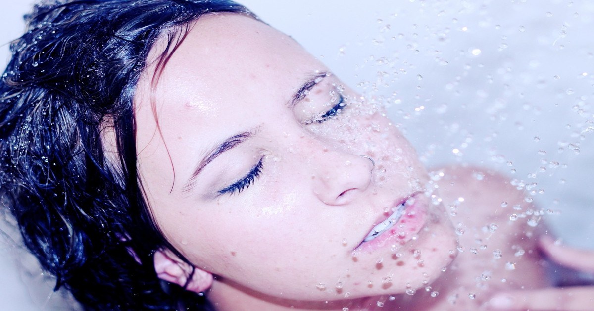 A woman taking a shower.