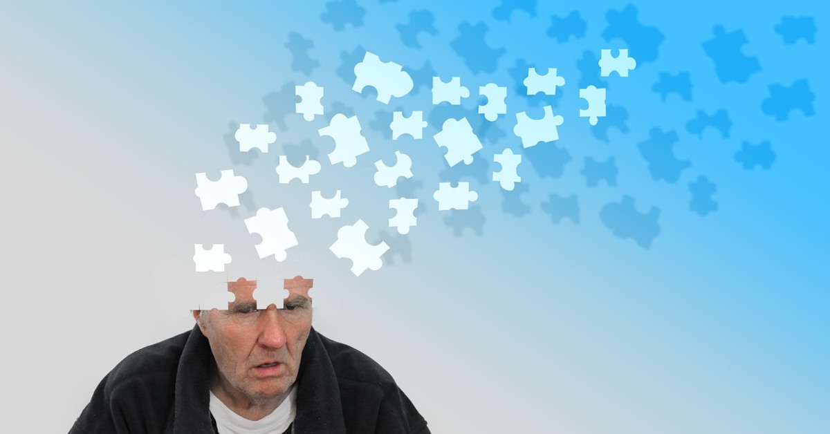 Image of a man with puzzle pieces missing in his brain, indicating that he's suffering from dementia.