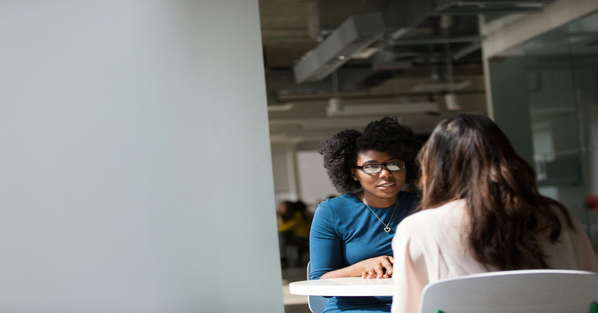 Two woman having a conversation.